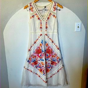 Anthropologie white floral and birds embroidered dress.
